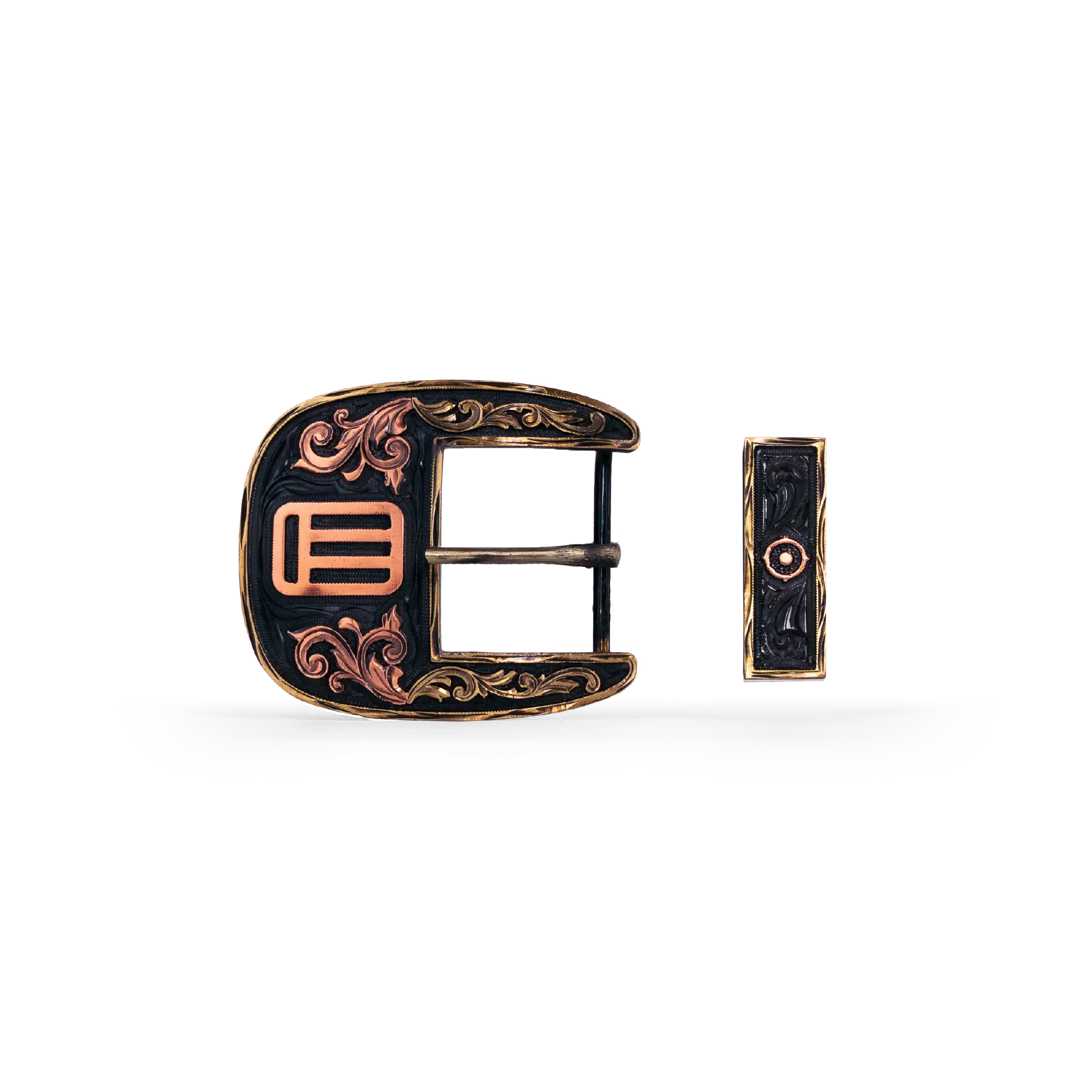 An ornate western-style belt buckle with gold-toned metal edges, and copper-toned scrollwork and geometric details, shown alongside its matching keeper on a white background.