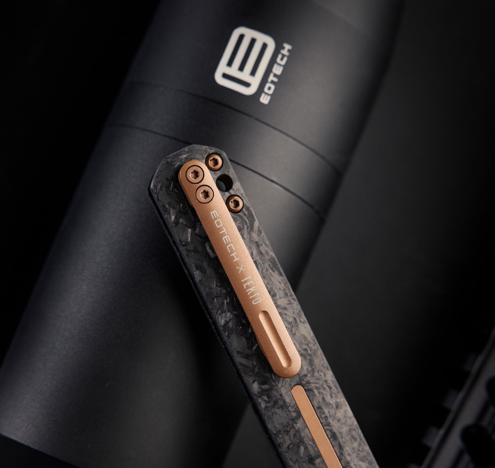 Eotech knife with a metallic finish on a dark background