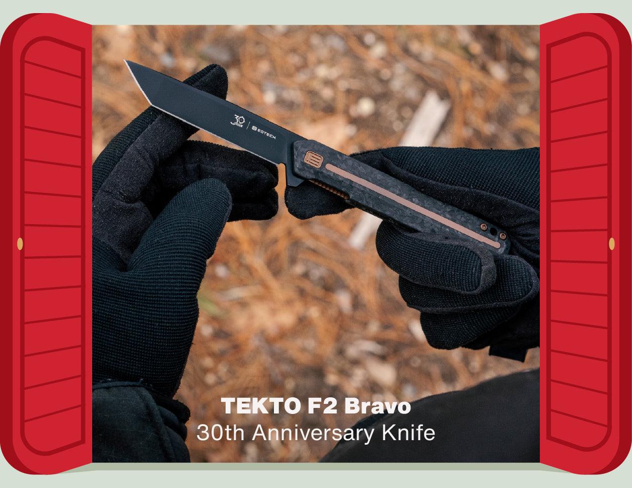 TEKTO F2 Bravo 30th Anniversary Knife held by a gloved hand with red doors open