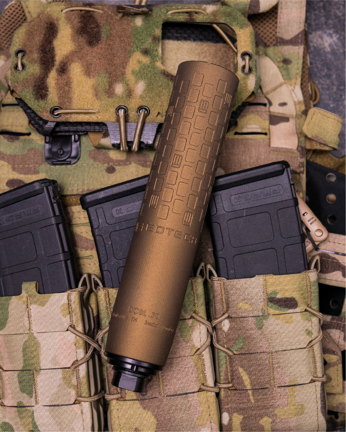 Tan EOTECH DCBL Suppressor on a camouflage background