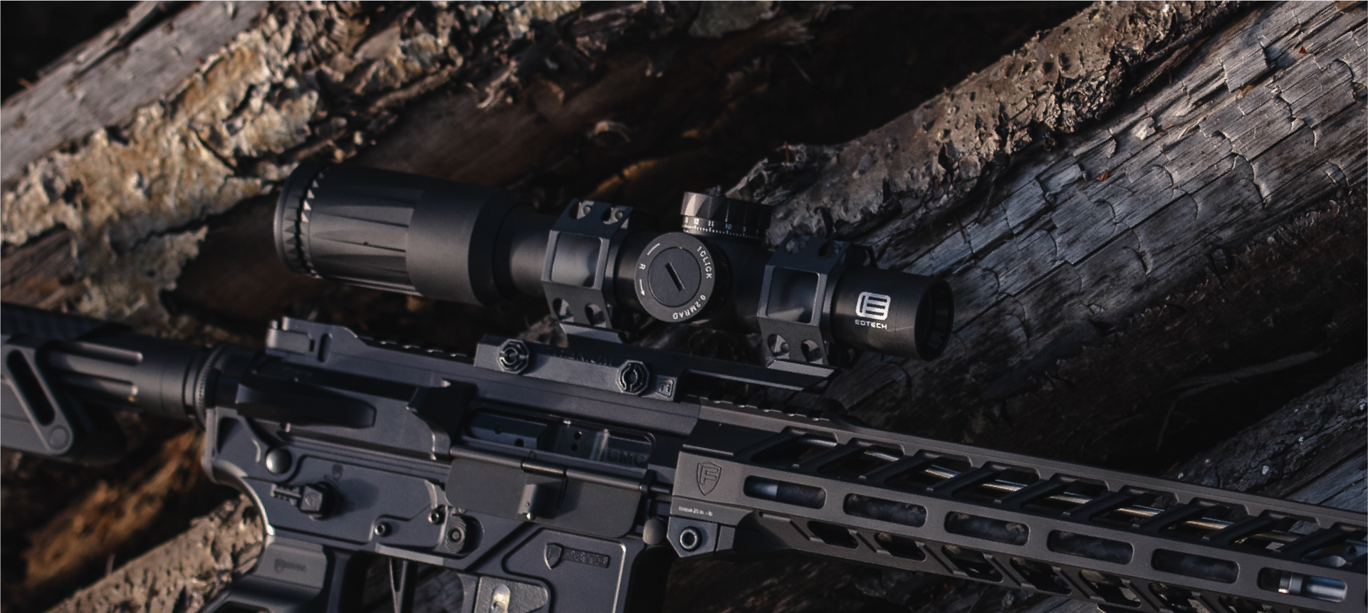 Rifle with EOTECH Vudu black scope on a wooden surface