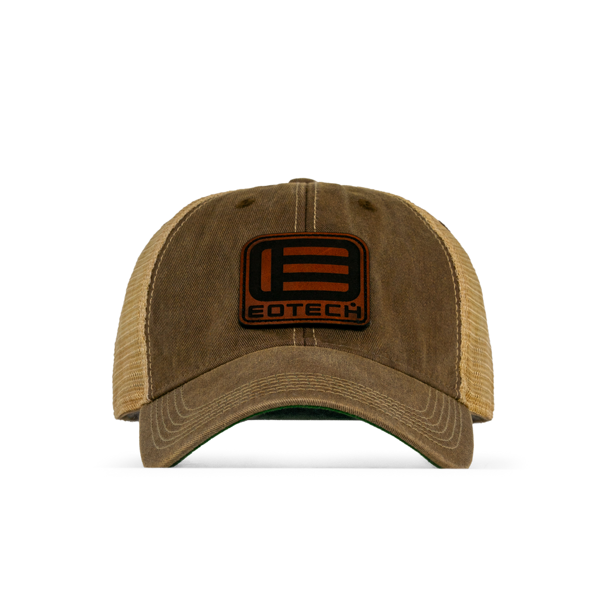 A trucker-style baseball cap with a washed brown front panel and curved brim, tan mesh back, and a black rectangular patch on the front featuring a stylized 'E' logo and the word 'EOTECH'.