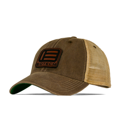 A brown and tan trucker-style baseball cap with a white mesh back, featuring a black and orange EOTECH logo patch on the front.