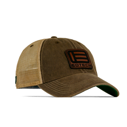 A brown and tan trucker-style baseball cap with a mesh back, featuring a prominent brown rectangular patch on the front with the EOTECH logo and text.