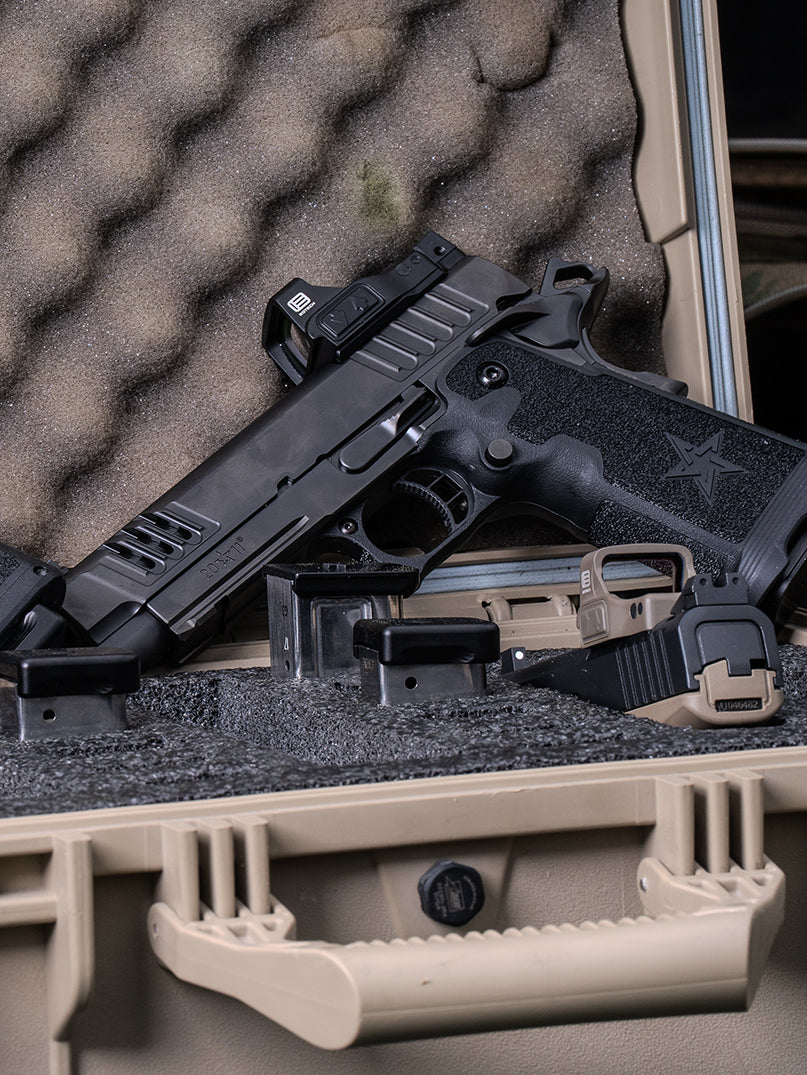 Two handguns with black and tan EFLX red dot optics  on a foam-lined gun case
