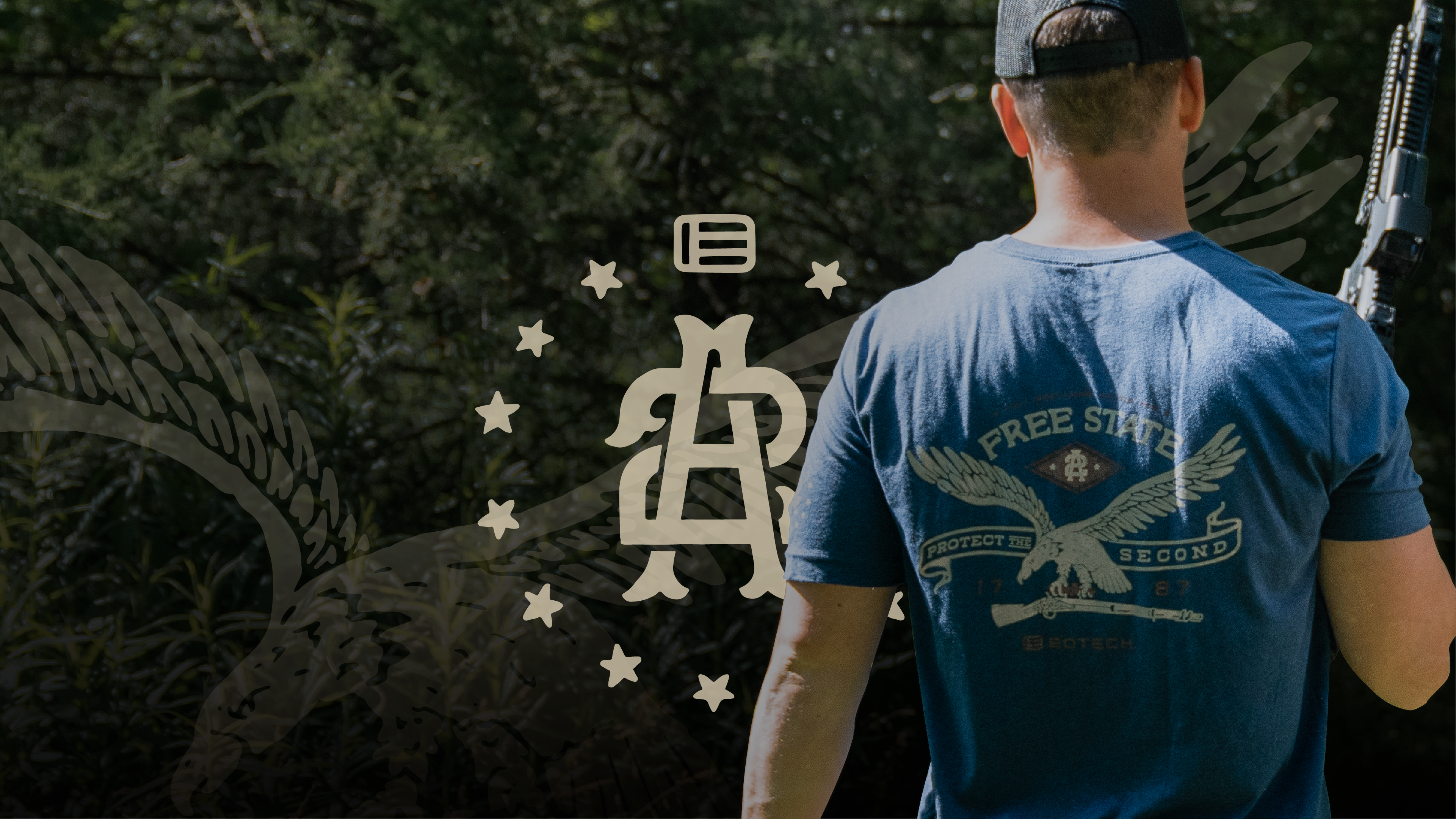 Man wearing a blue t-shirt with a Protect the Second logo and text, standing outdoors.