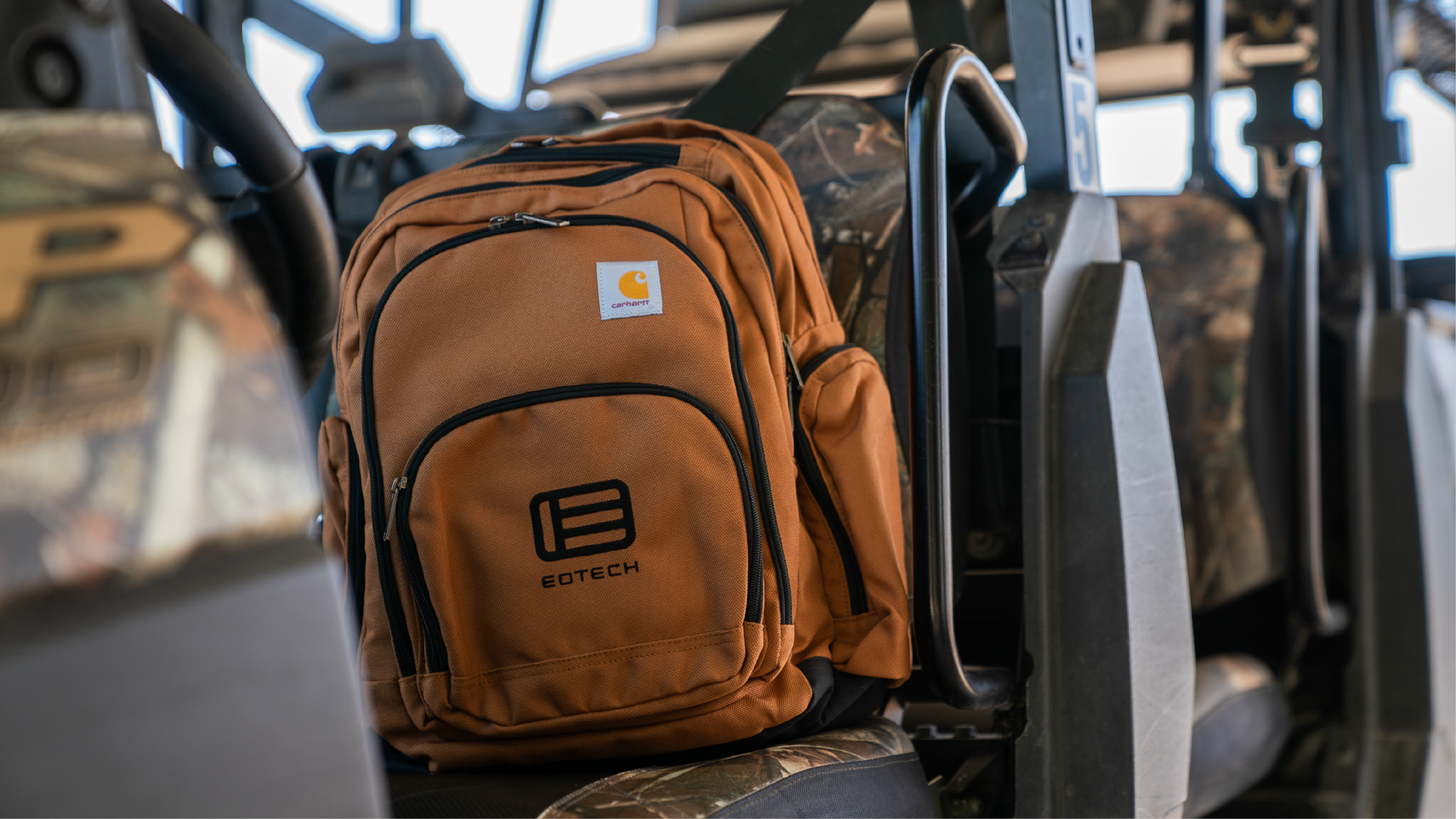 Brown EOTECH backpack vehicle in background