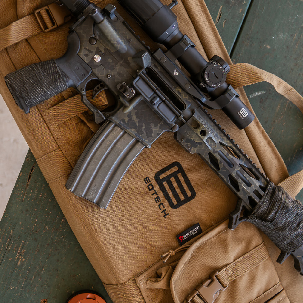 Camo Rifle on a tan EOTECH gun case with Vudu scope