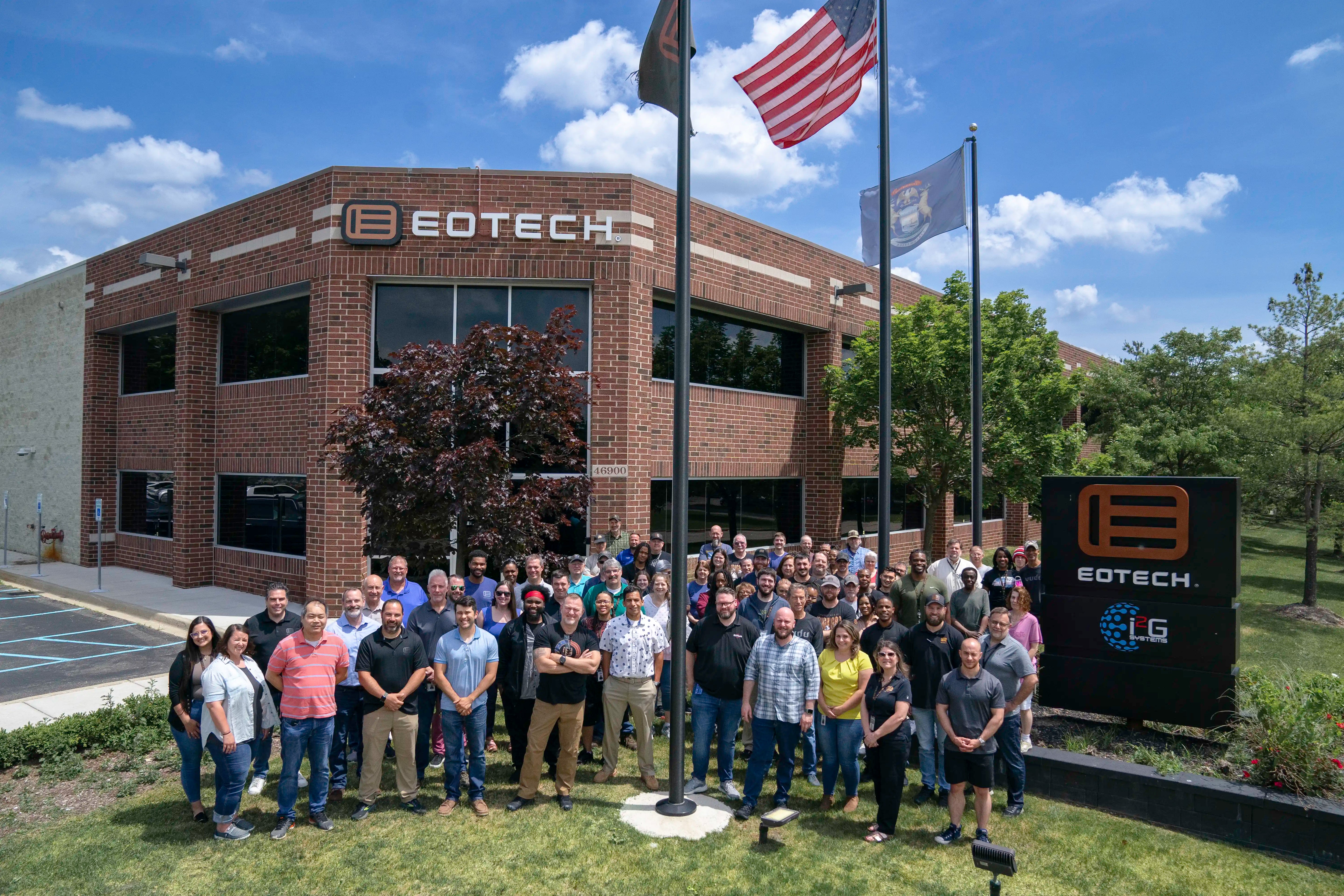 Group of people posing in front of EOTECH office