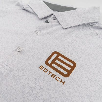 Close-up of a light gray patterned polo shirt with a brown EOTECH logo on the chest.