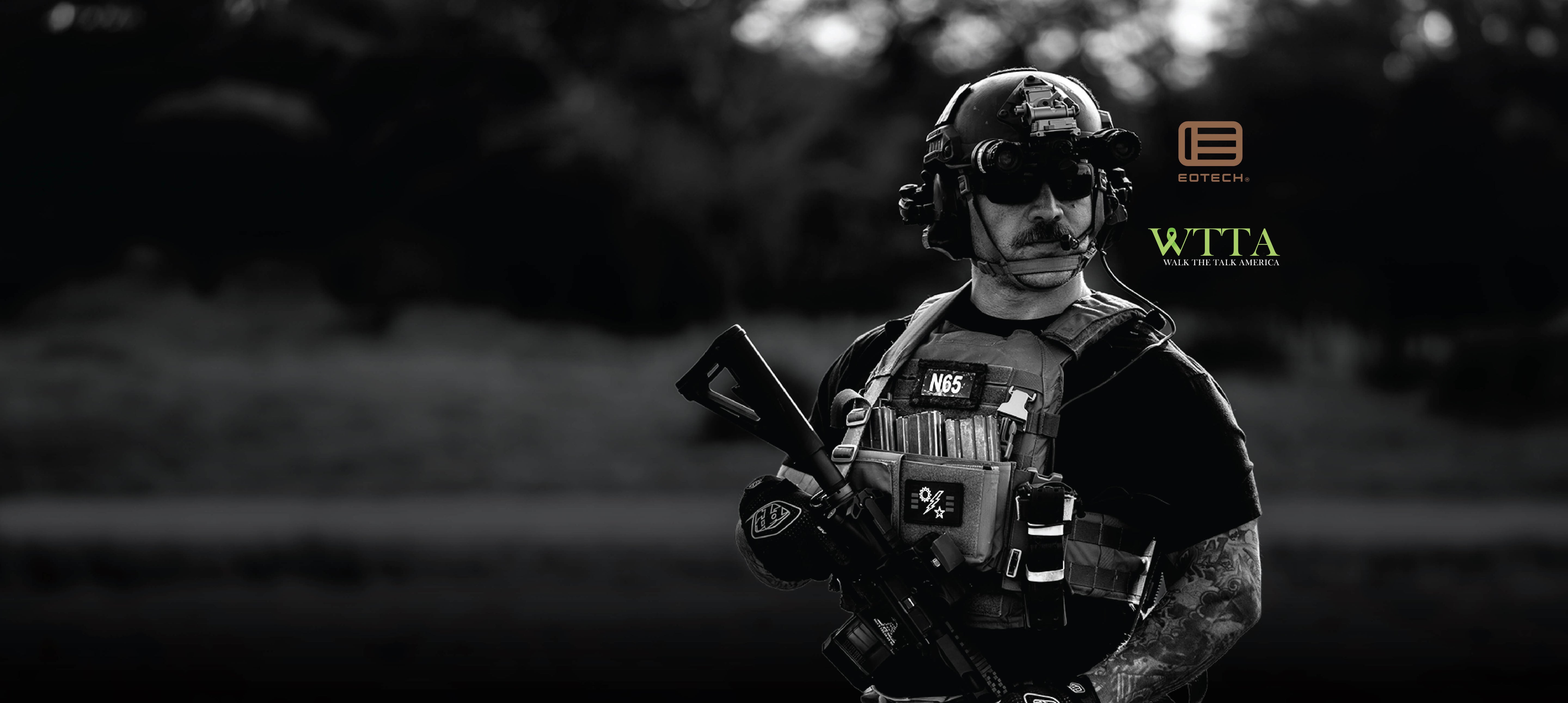 Person in tactical gear with a blurred natural background
