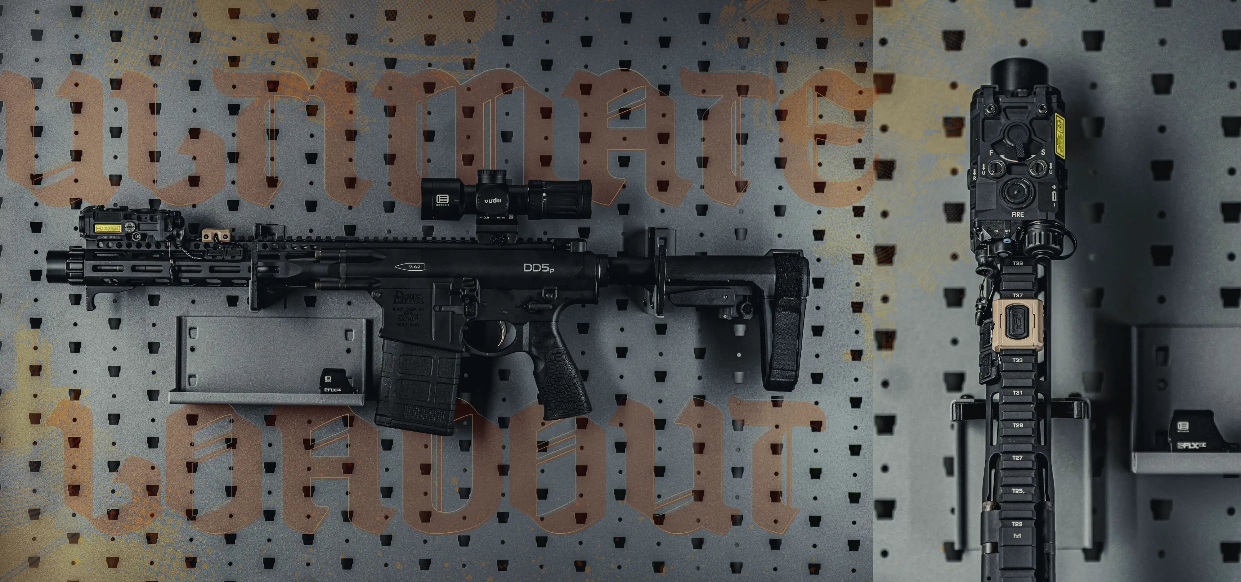 Black rifle on a pegboard with 'Ultimate Loadout' branding.