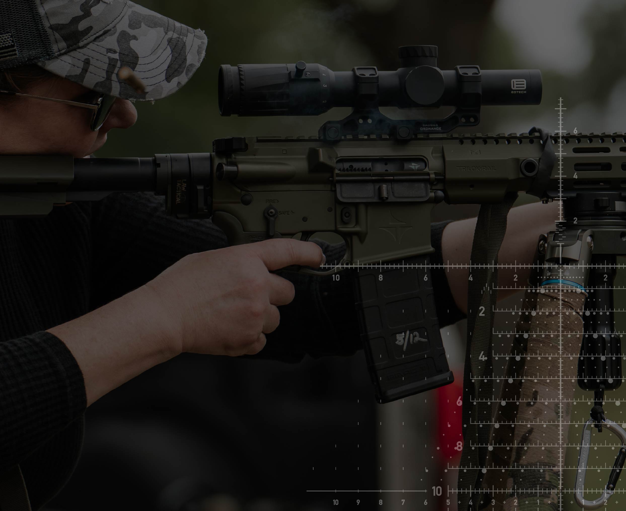 Female holding rifle with EOTECH Vudu scope and reticle overlay