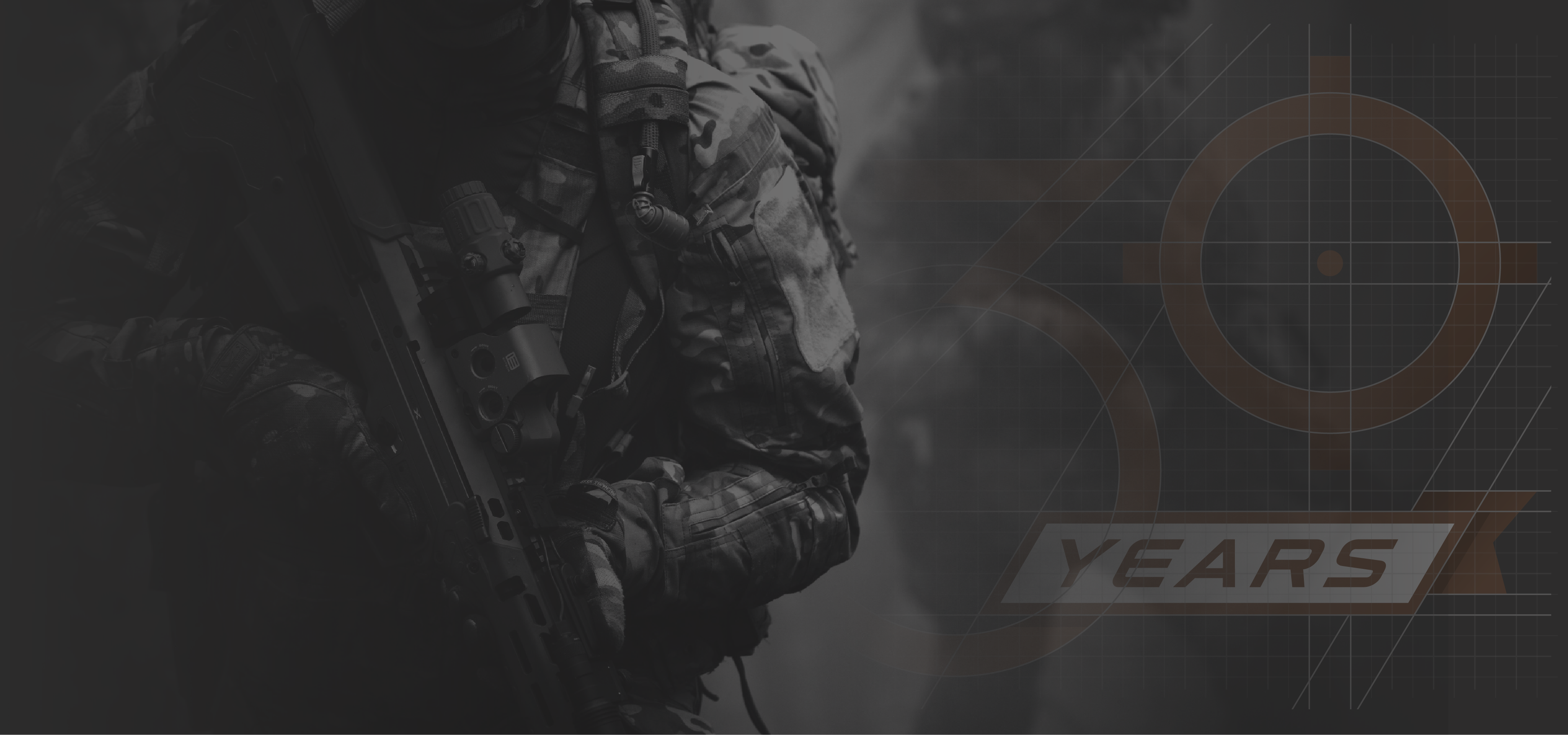 Person in camouflage holding a rifle with EOTECH HWS and magnifier with a blurred background and 30 YEARS logo.