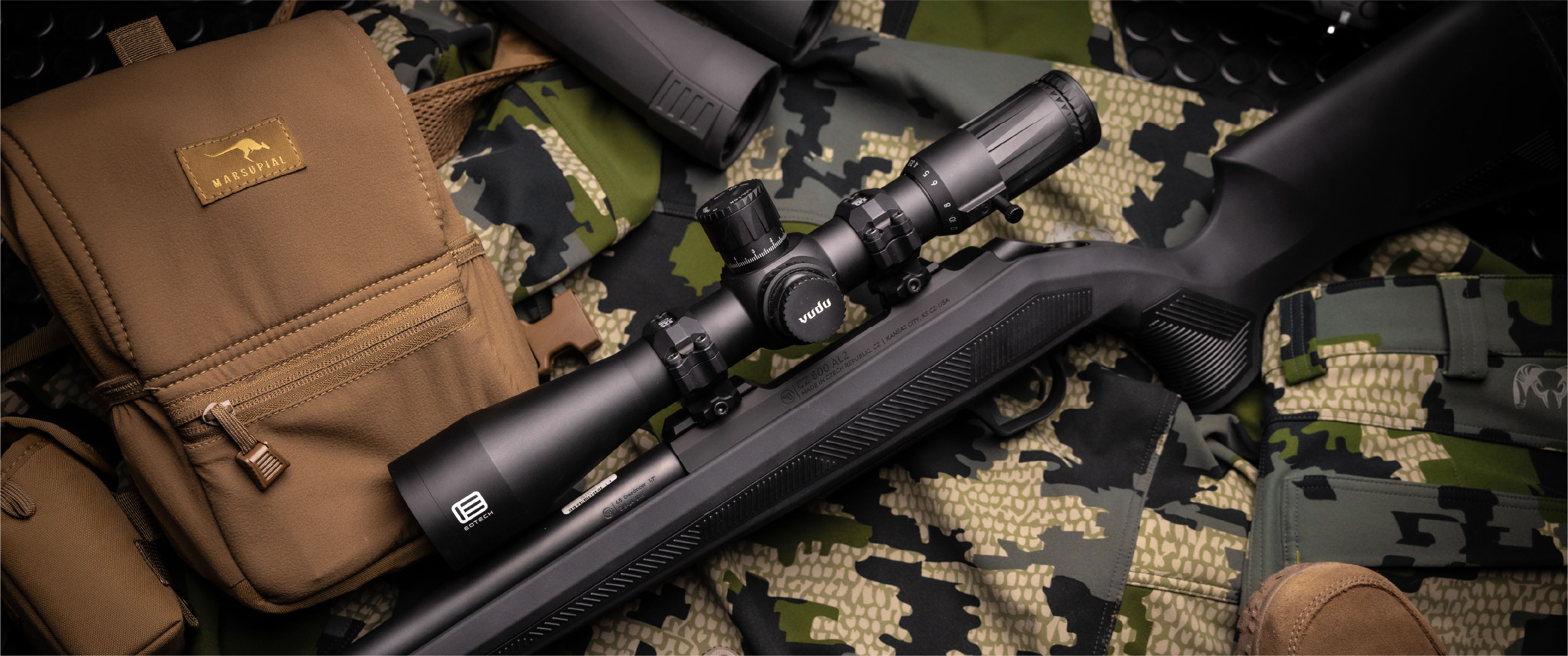 EOTECH Vudu Riflescope with a brown case on camouflage-patterned fabric